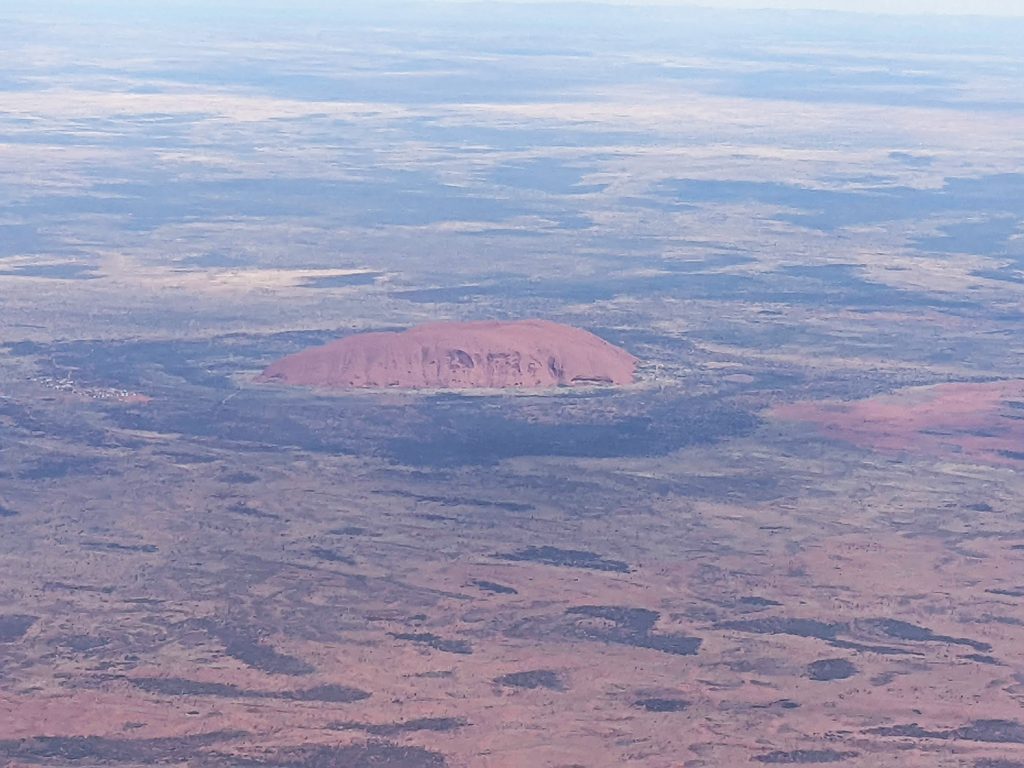 Aerial view of Uluru while flying to Yalara with Qantas