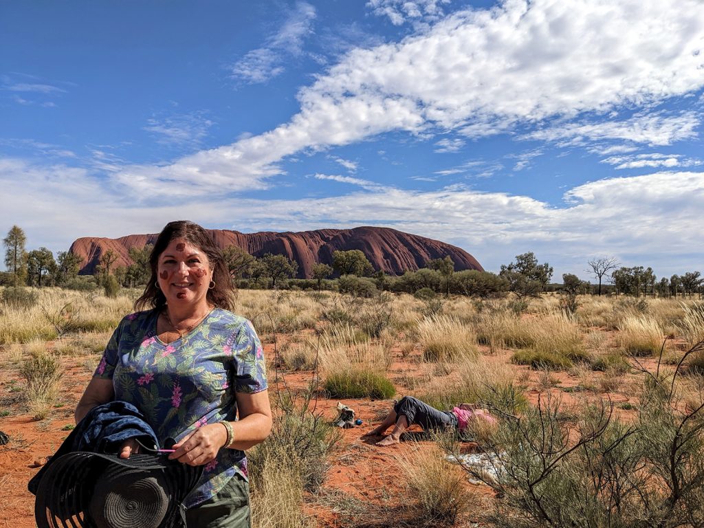 Senka in front of Uluru Tuesday 11am grounding meditation